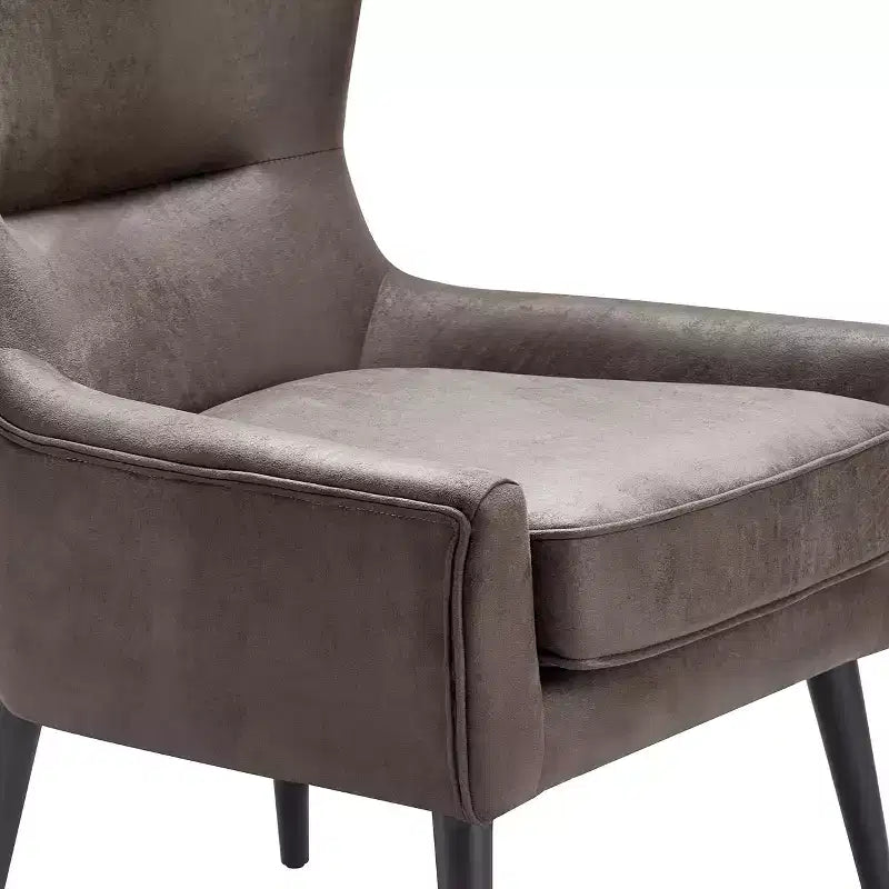 Fauteuil scandinave à oreilles en similicuir touffeté